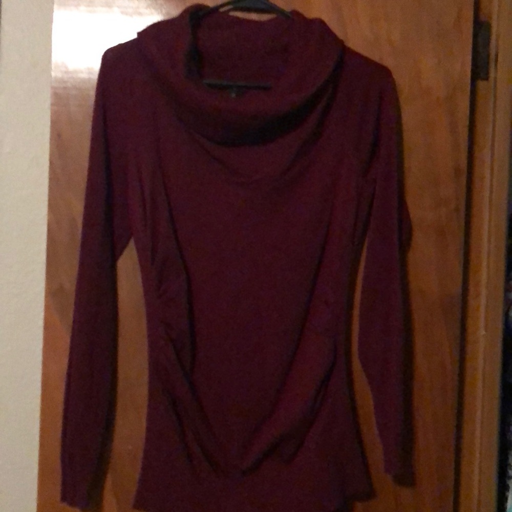 Maurice’s maroon turtle neck